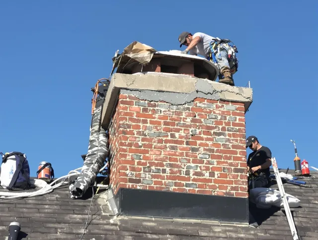 Wilmington Island Chimney Sweep installing a custom chimney crown in Wilmington Island, GA