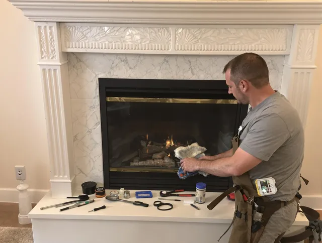 Wilmington Island Chimney Sweep performing fireplace maintenance in Wilmington Island, GA